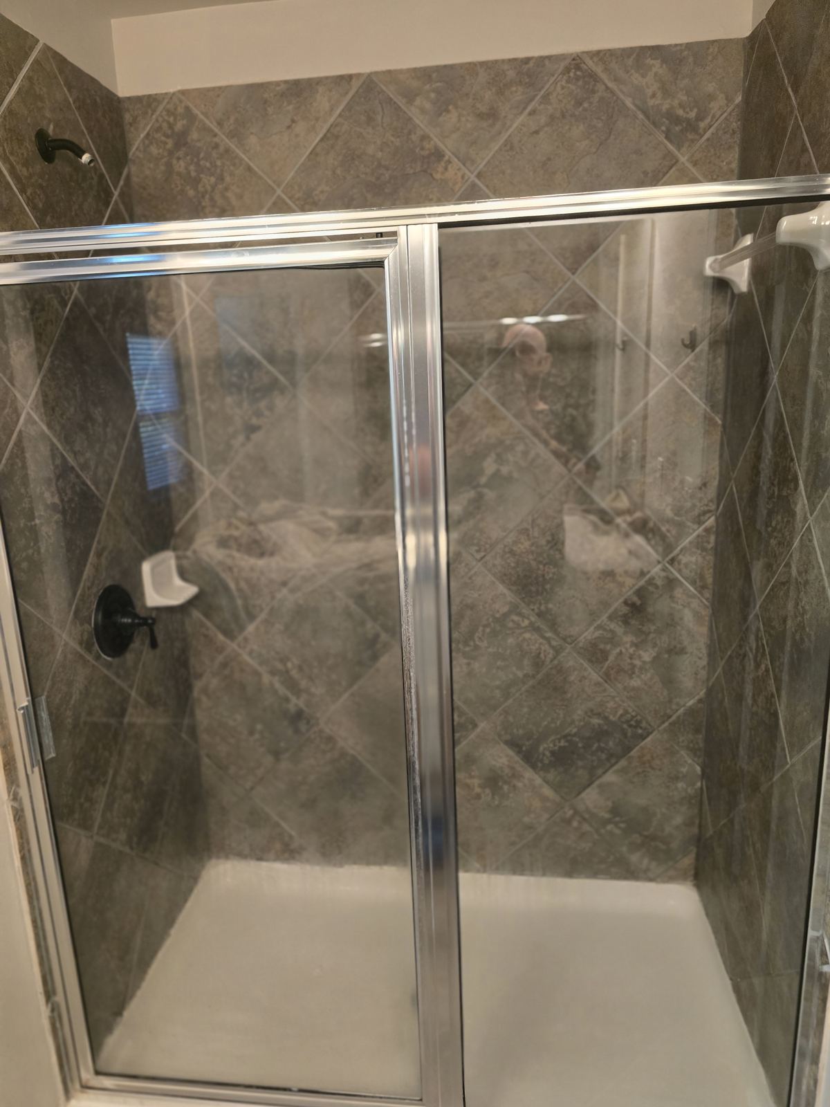 Before — existing bath. FusionFlow Showers install by Joshua Waldrep.